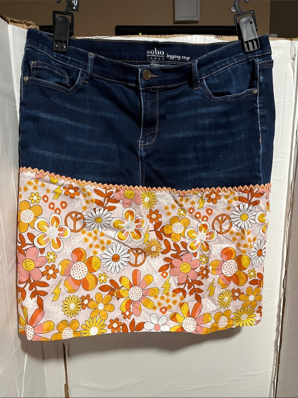 Soho Navy Denim Skirt with Orange, Yellow and Pink Floral Panel. 20” long.